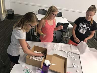 Students starting to assemble their cooler.