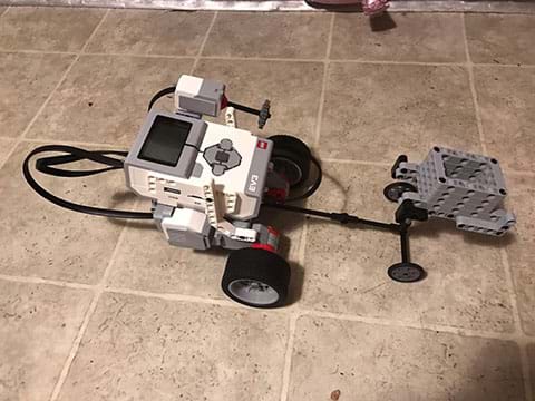 Fourth experimental set-up showing the wheels with tires on a tile surface.