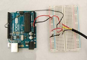 A photograph shows the numerous colored wires from an Arduino microcontroller and thermal sensor connected to a breadboard.