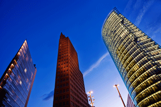 Photo shows three very tall skyscrapers.