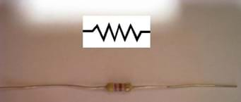 An image showing a resistor and a schematic of its electrical charge.