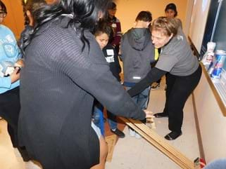 Teacher and students gathered at the testing of the crash ramp.