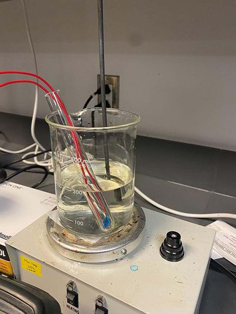 A water bath apparatus is created using a test tube suspended in a beaker full of water on a hot plate. The temperature is measured by a suspended thermometer and the resistance is measured by a resistance probe that are attached to the crystal within the test tube. 