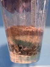 A photo showing the layering design where clay is the cap layer. Sand is placed in between gravel and clay. A photo showing the layering design where clay is the cap layer. Sand is placed in between gravel and clay.