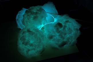 A photograph shows a bluish cloud-like lantern with a visible stretch of LED lights.