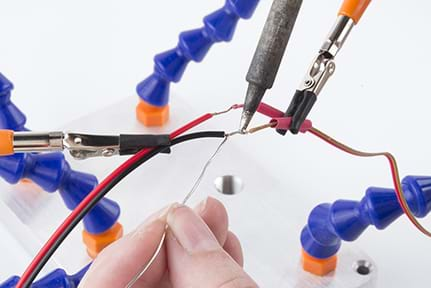 A photograph shows the EL panel cable being held with clamps and soldered to a new length of wire (ribbon cable).