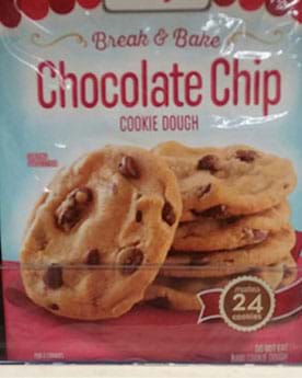 A picture is of pre-made chocolate chip cookie dough on a supermarket shelf.