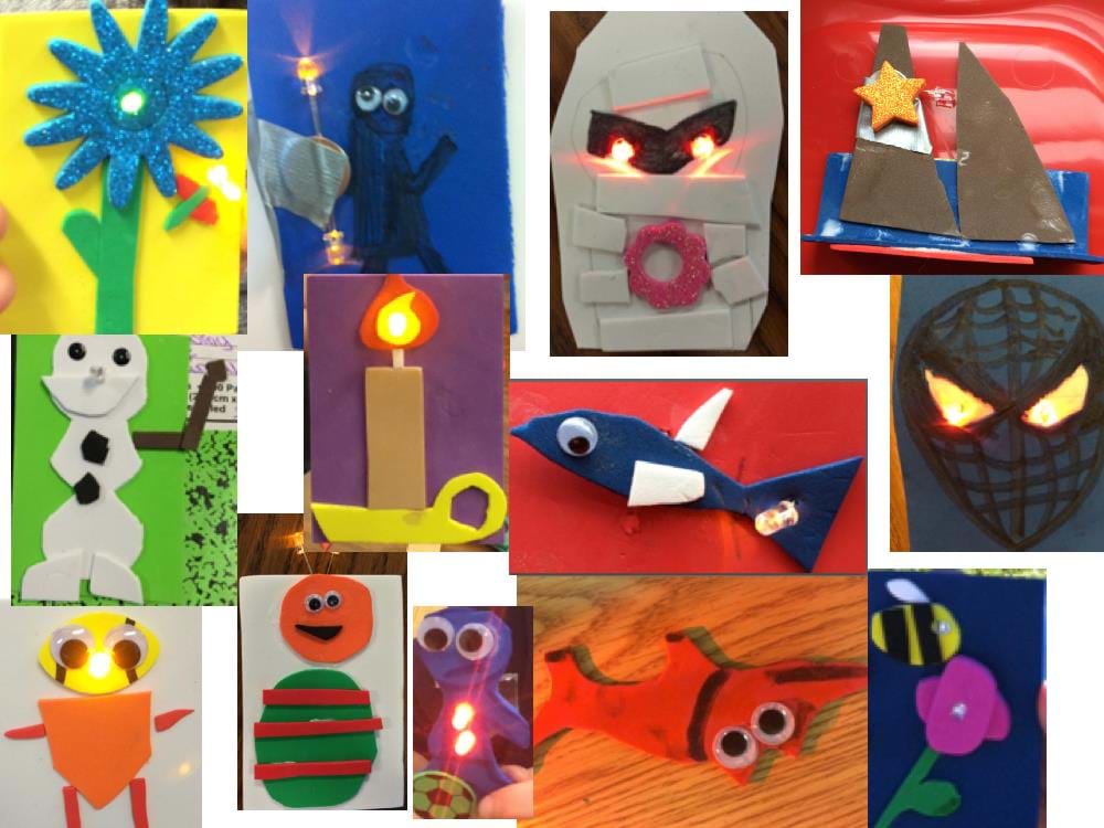 Photograph of foam LED artwork made by elementary school children. Some of the images include a candle, Spiderman, fish, snowman, flower, mummy, bee, sailboat and ET.