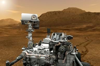 An artist's illustration shows a robot on wheels with a camera and sensors on the red-soil surface of Mars.