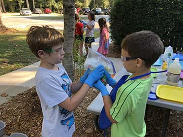 Students testing the washing machine prototype.