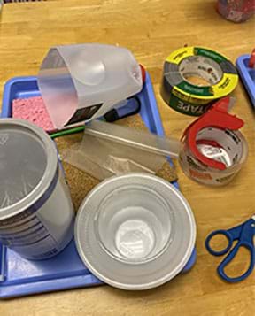 Some supplies students may select for this project include oatmeal canisters, sponge, wax paper, cork, duct tape, packing tape, small bungee cords, zip ties, Styrofoam plates, scissors, and ruler.