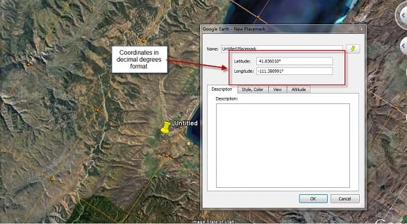 A window from Google Earth is seen over a mountainous area. A dialog window over a lake shows latitude and longitude coordinates. A yellow pushpin on the map marks the location corresponding to those coordinates.