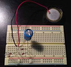 The same breadboard as figure 3, now with a capacitor connected.