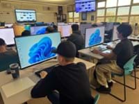 A photo showing students working on their lab computers.