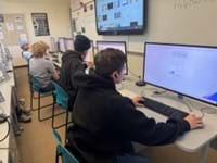 A photo showing students working on their lab computers.