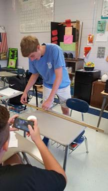 Photograph of students performing a gum stretch.