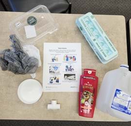 A teacher example of a Polymer Card Station with sample Polymers.