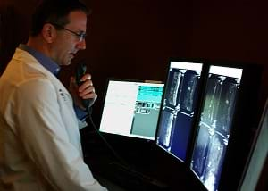 A radiologist examining X-rays from his patient.