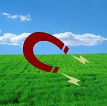 A comedic representation of a magnetic field shows a horseshoe-shaped magnet in a green field with lightning bolts emerging from each magnet end.