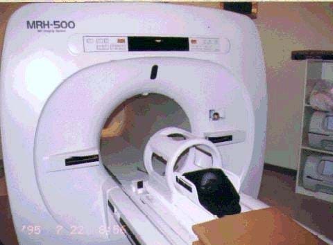 A photograph shows an MRI machine.