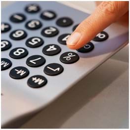 Photo shows a keypad with a person's finger about to press on a button.