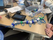 A photo of a completed polypeptide model and the Vernier LabQuest in the background showing when the bonds between the amino acids break. A photo of a completed polypeptide model and the Vernier LabQuest in the background showing when the bonds between the amino acids break.