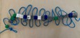 A photo showing a model polypeptide, containing amino acids that are gray, green, white, and blue. A photo showing a model polypeptide, containing amino acids that are gray, green, white, and blue.